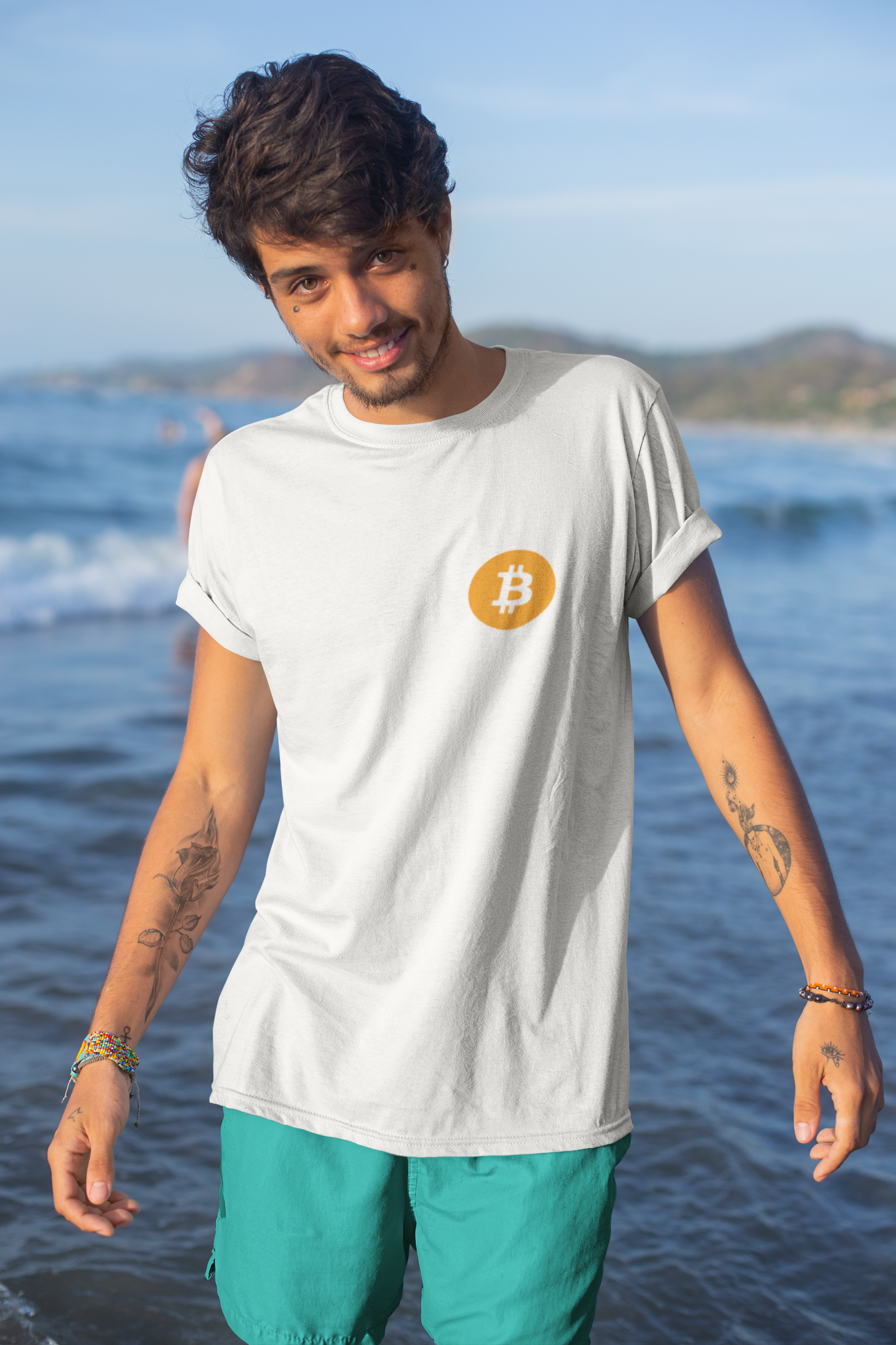 mockup-of-a-tattooed-young-man-by-the-sea-wearing-a-t-shirt-26767